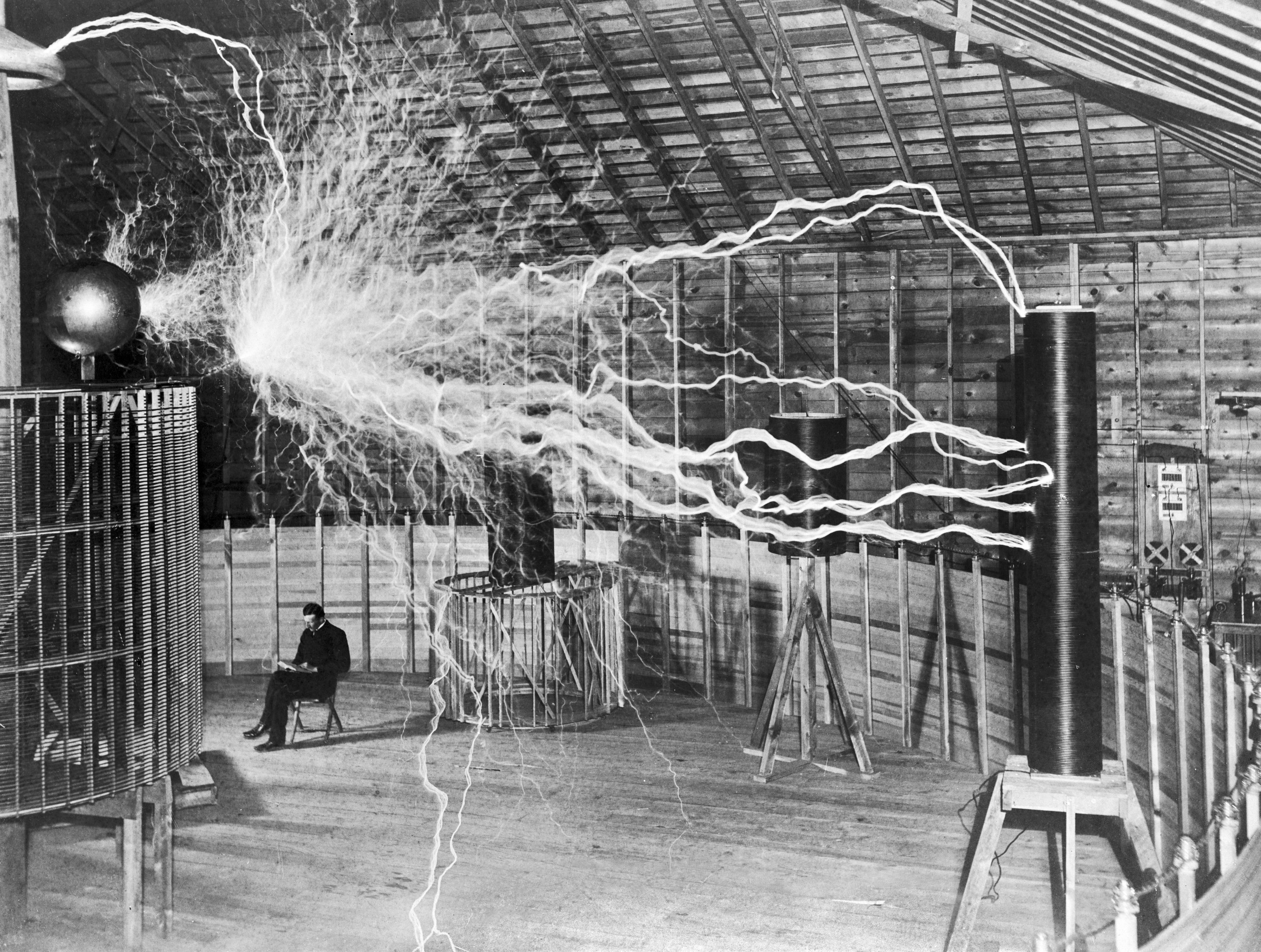 Nikola Tesla with his equipment EDIT scaled